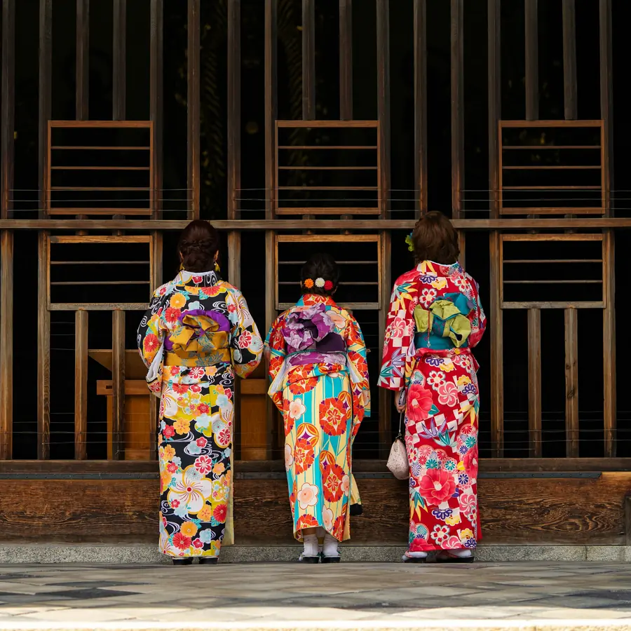 Travelers in rented kimono on a Kyoto lane